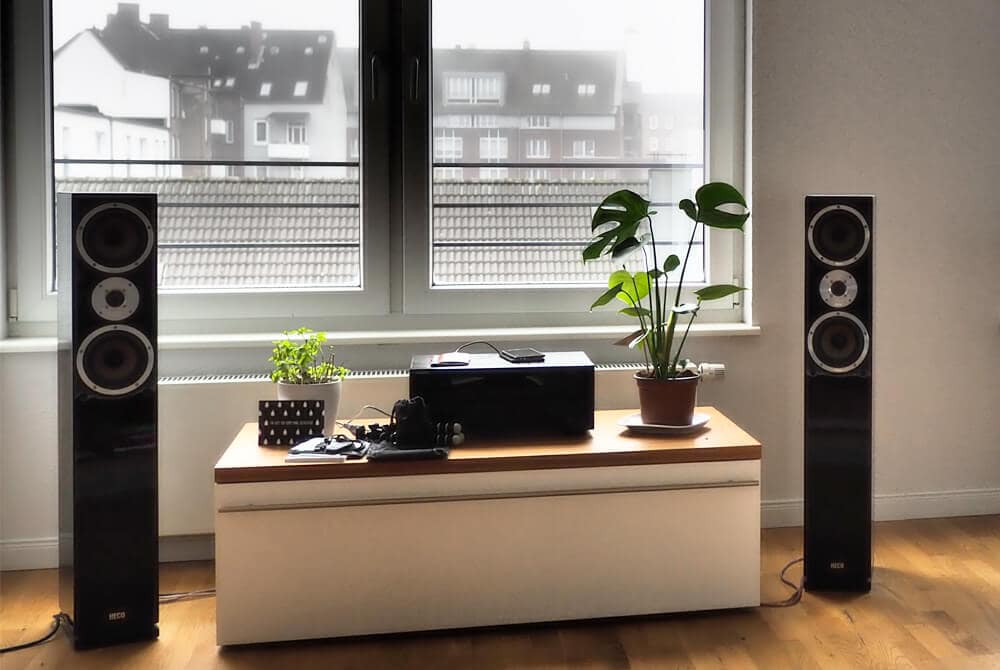 floor-standing speakers in a room